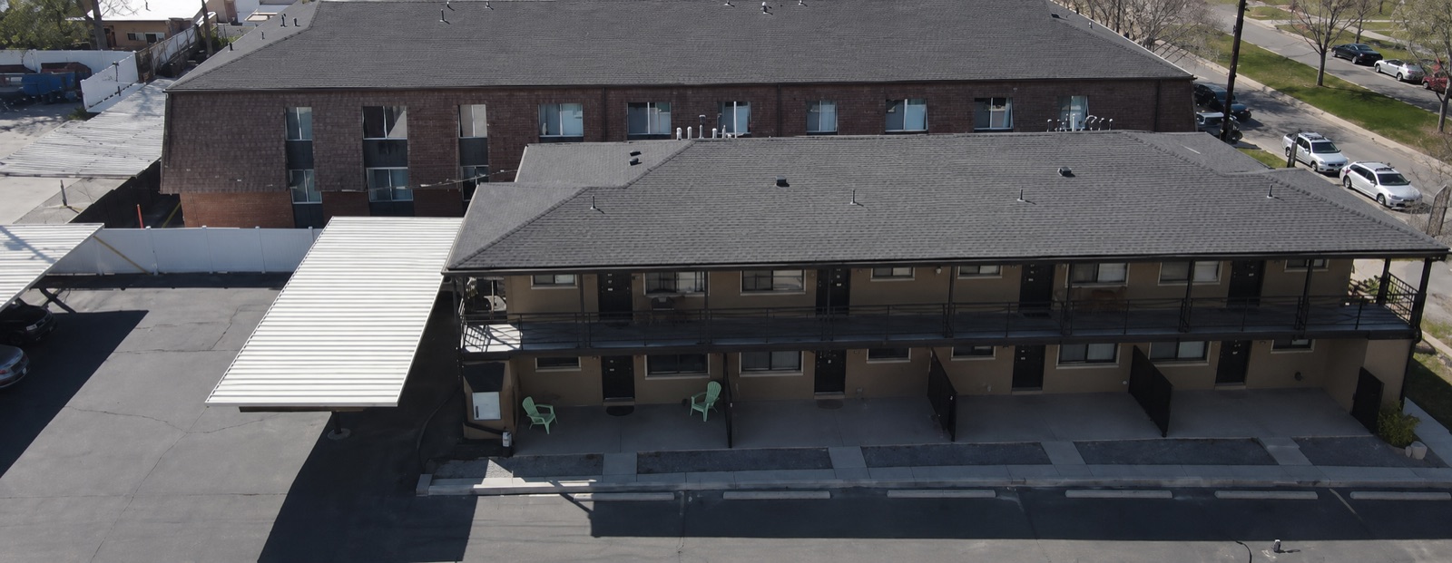 Rear courtyard with covered parking and private patios